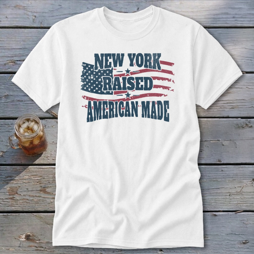 White t-shirt with distressed American flag graphic and text reading New York Raised American Made.