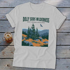 Light gray crewneck t-shirt featuring a stylized graphic of Dolly Sods Wilderness with evergreen trees and text.