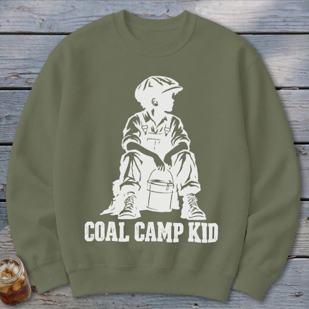 Olive green sweatshirt with white graphic of a boy in overalls holding a bucket.