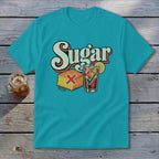 Teal t-shirt with a retro graphic of cornbread marked with a red X and iced tea marked with a green checkmark below the word Sugar.