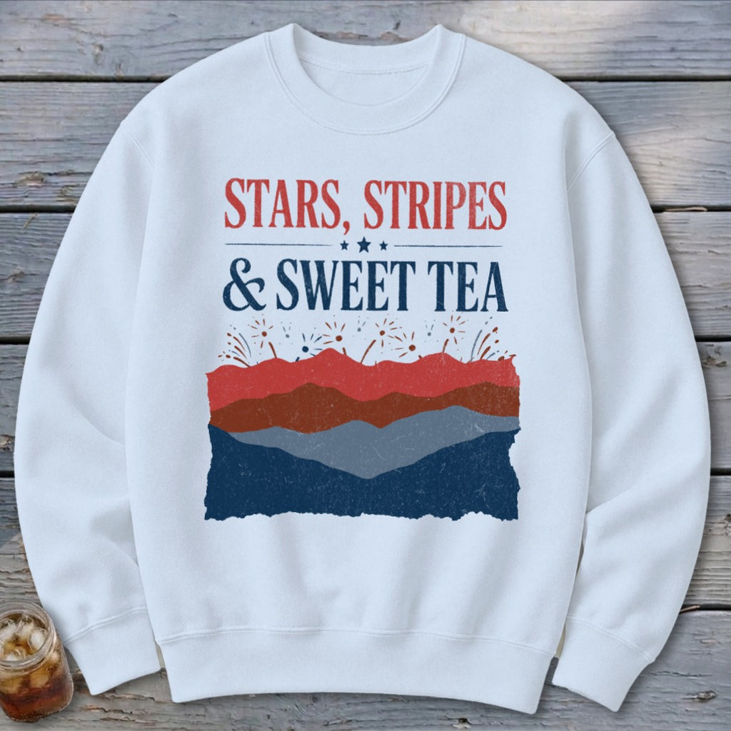 White crewneck sweatshirt featuring red and blue patriotic text that reads STARS, STRIPES & SWEET TEA.