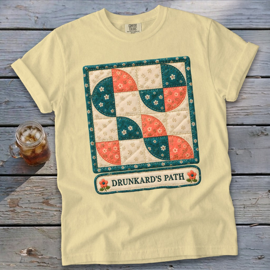 Yellow t-shirt with a "Drunkard's Path" quilt design featuring teal and coral floral patterns.