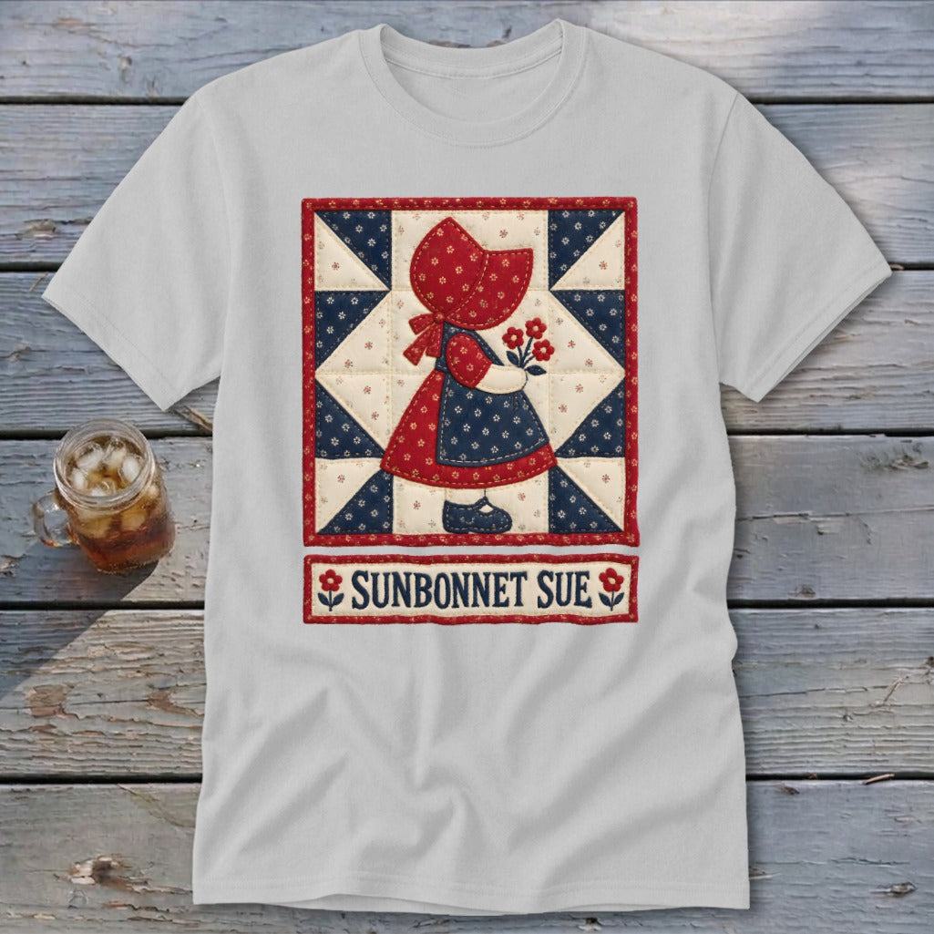 Sunbonnet Sue illustration on a white t-shirt with a quilt pattern and text.