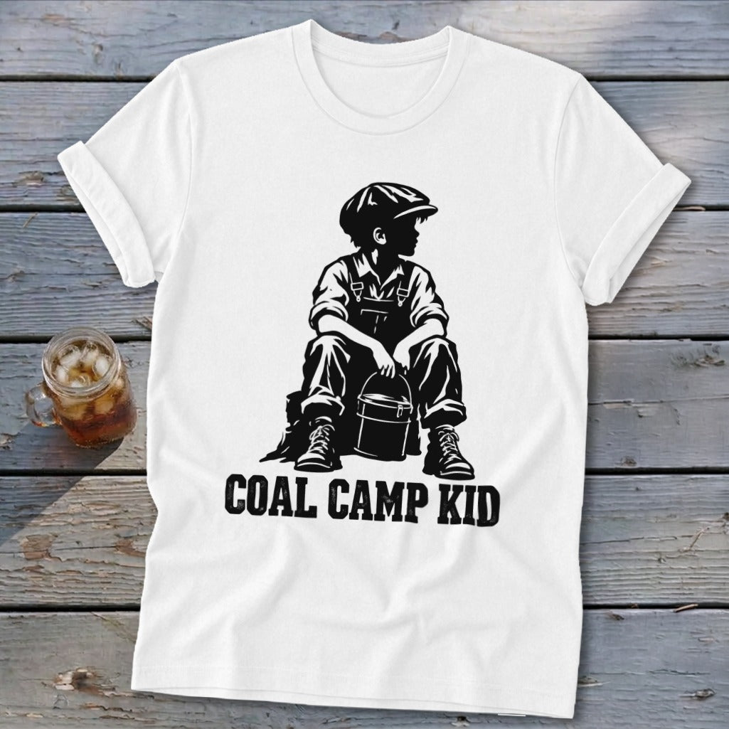 White t-shirt with black graphic of a boy in overalls holding a bucket, text reads "Coal Camp Kid".