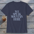 Navy V-neck t-shirt with "WE SPEAK MOUNTAIN HERE" text in light blue.