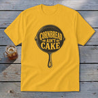 Yellow t-shirt with a black skillet graphic and "Cornbread Ain't Cake" text.