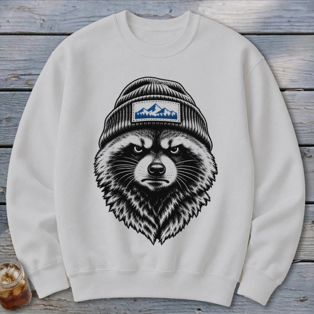 White sweatshirt with a graphic of a raccoon wearing a beanie with a mountain patch.