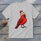 Light gray short-sleeve t-shirt featuring an illustration of a red cardinal wearing a winter hat.