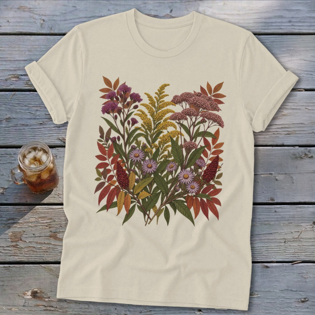 Cream t-shirt featuring a botanical illustration of fall wildflowers and foliage.