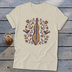 Cream t-shirt with folk art design of a lute and birds among flowers.