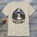 Cream t-shirt graphic featuring a waterfall, moonbow, moon, and trees with text "MOONBOW NIGHT".