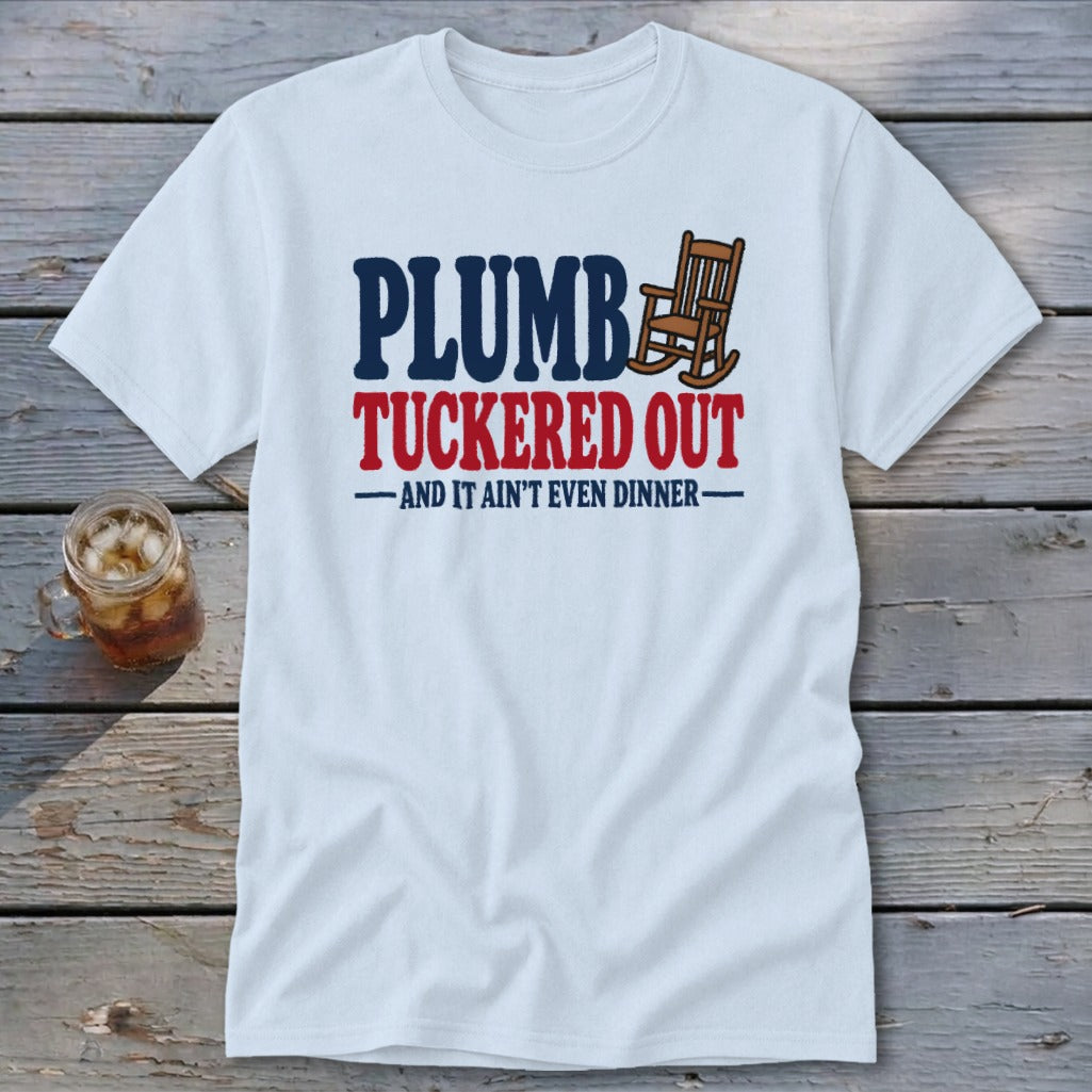 White t-shirt with "PLUMB TUCKRED OUT AND IT AIN'T EVEN DINNER" text and rocking chair.