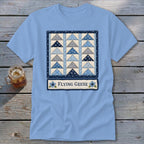 Light blue t-shirt with a framed quilt block design and the text "FLYING GEESE".