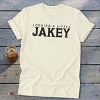 Cream t-shirt with black text reading "LOOKING A LITTLE JAKEY".
