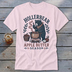Bear making apple butter with "HOLLERBEAR APPLE BUTTER SEASON" text.