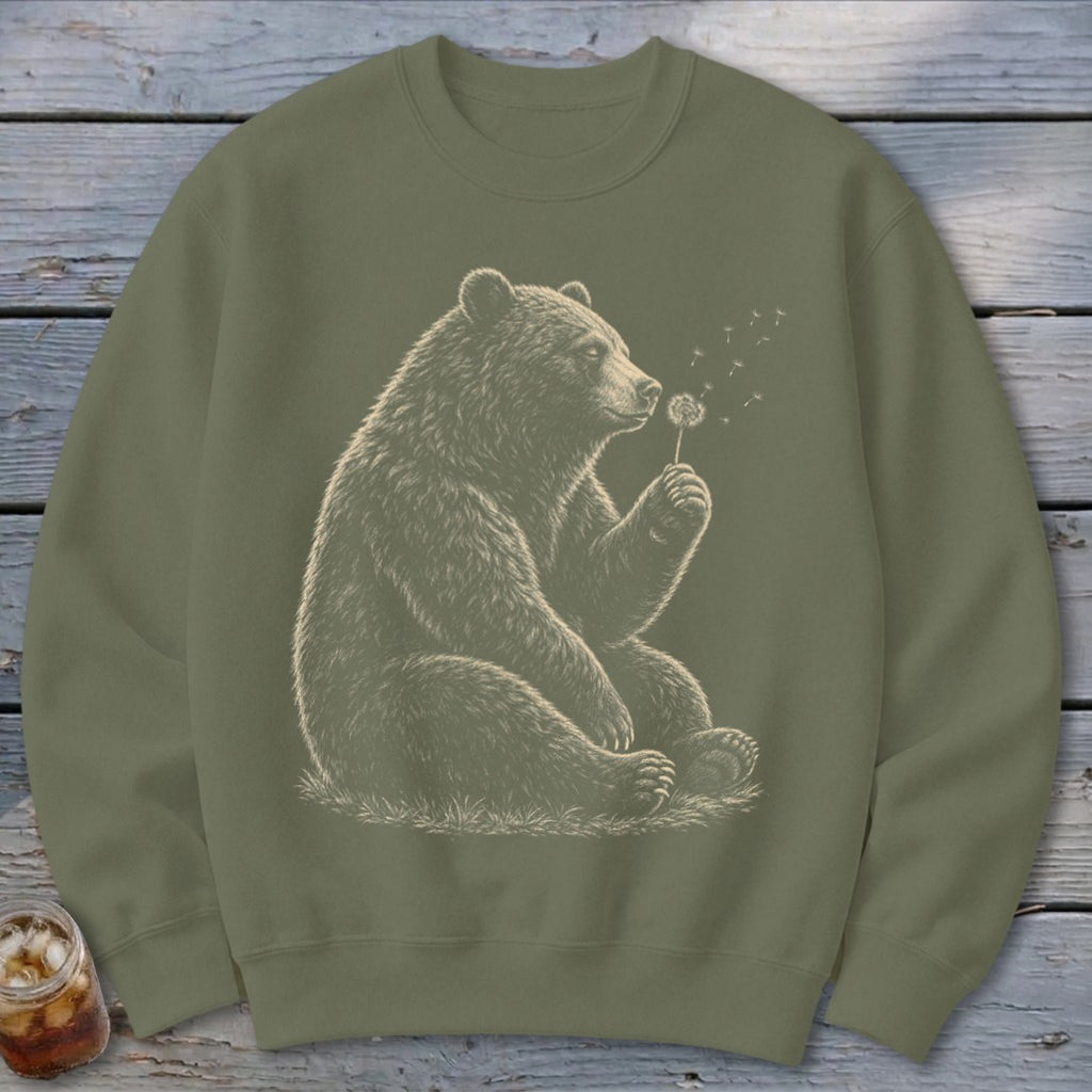 Olive green sweatshirt with bear blowing dandelion seeds graphic.