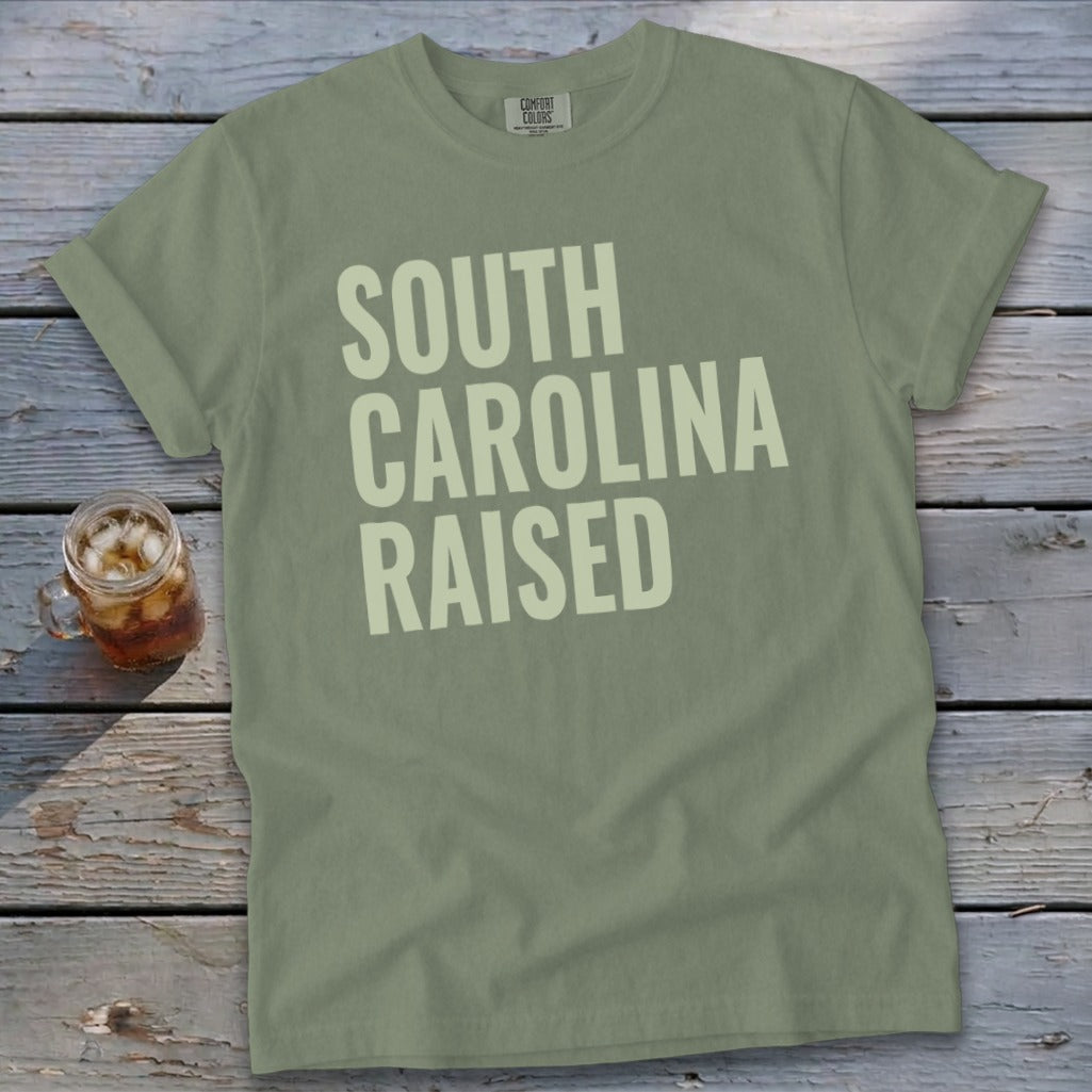 Green Comfort Colors t-shirt with "SOUTH CAROLINA RAISED" text and glass of iced tea.