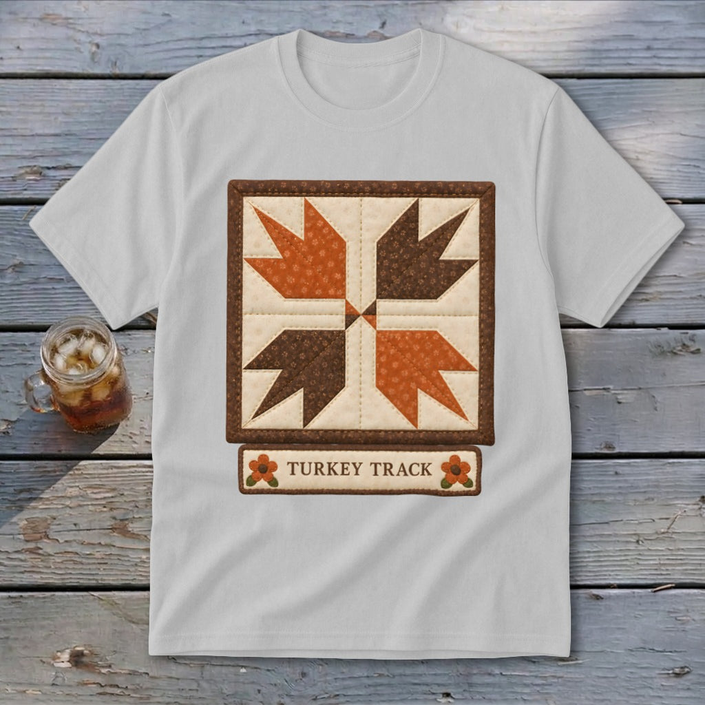 White t-shirt with a quilted turkey track design and the text "Turkey Track".