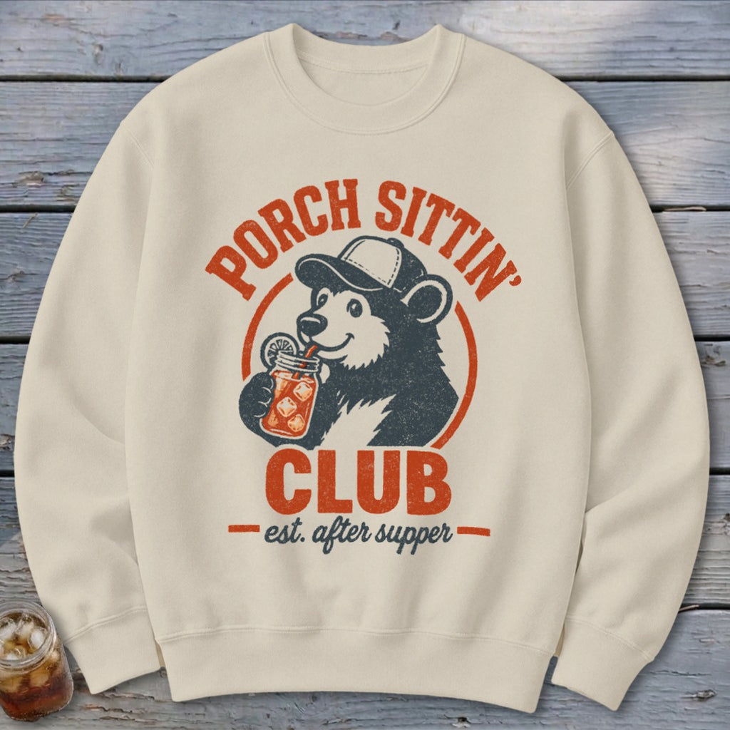 Cream sweatshirt with a vintage design of a bear drinking from a jar.