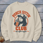 Cream sweatshirt with a vintage design of a bear drinking from a jar.
