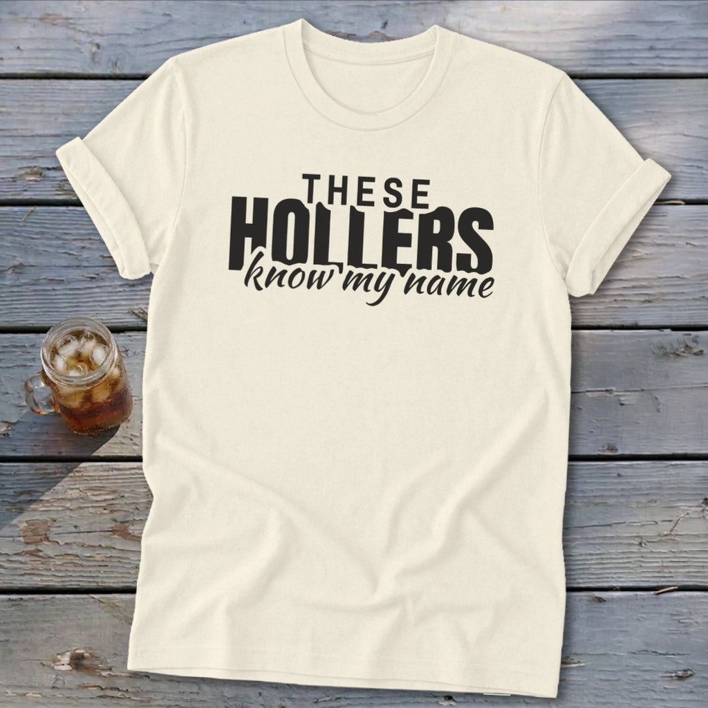 Cream t-shirt with black text that says "THESE HOLLERS know my name".