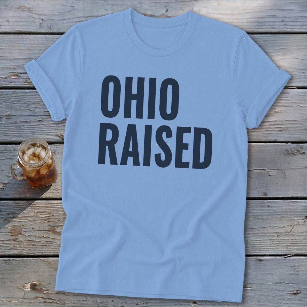 Light blue t-shirt with bold dark blue text "OHIO RAISED" and a glass of iced tea.