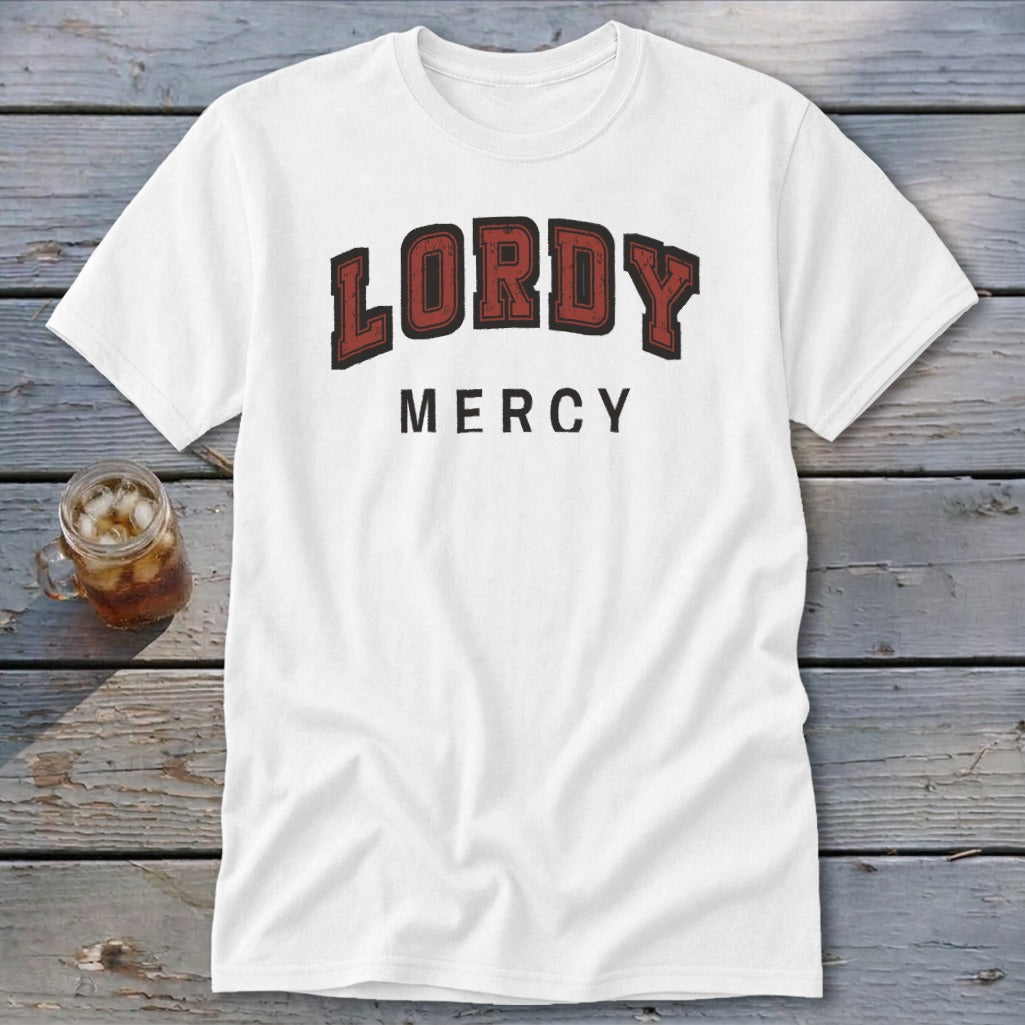 White t-shirt with "LORDY MERCY" text printed in red and black lettering.