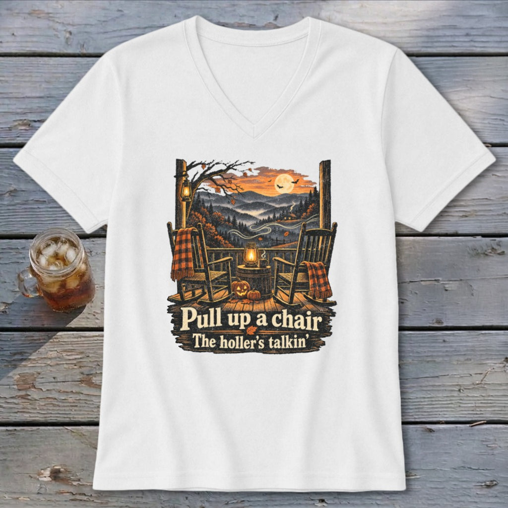 White t-shirt with a graphic of rocking chairs on a porch and the text "Pull up a chair The holler's talkin'".
