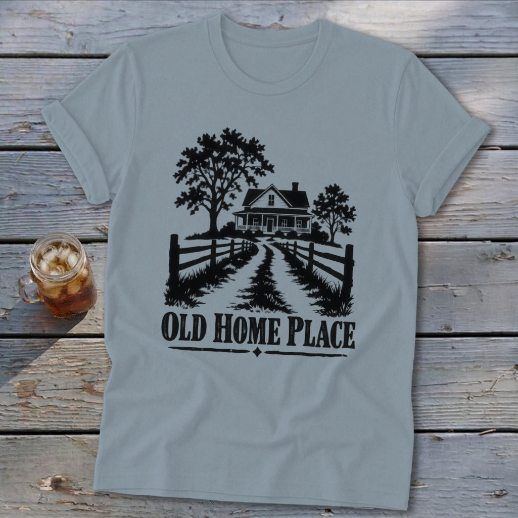 Light blue t-shirt with a black graphic of a house, trees, and fence, saying "OLD HOME PLACE".