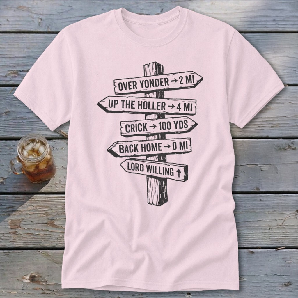 A light pink t-shirt featuring a black graphic of a rustic wooden signpost with directional distance text.