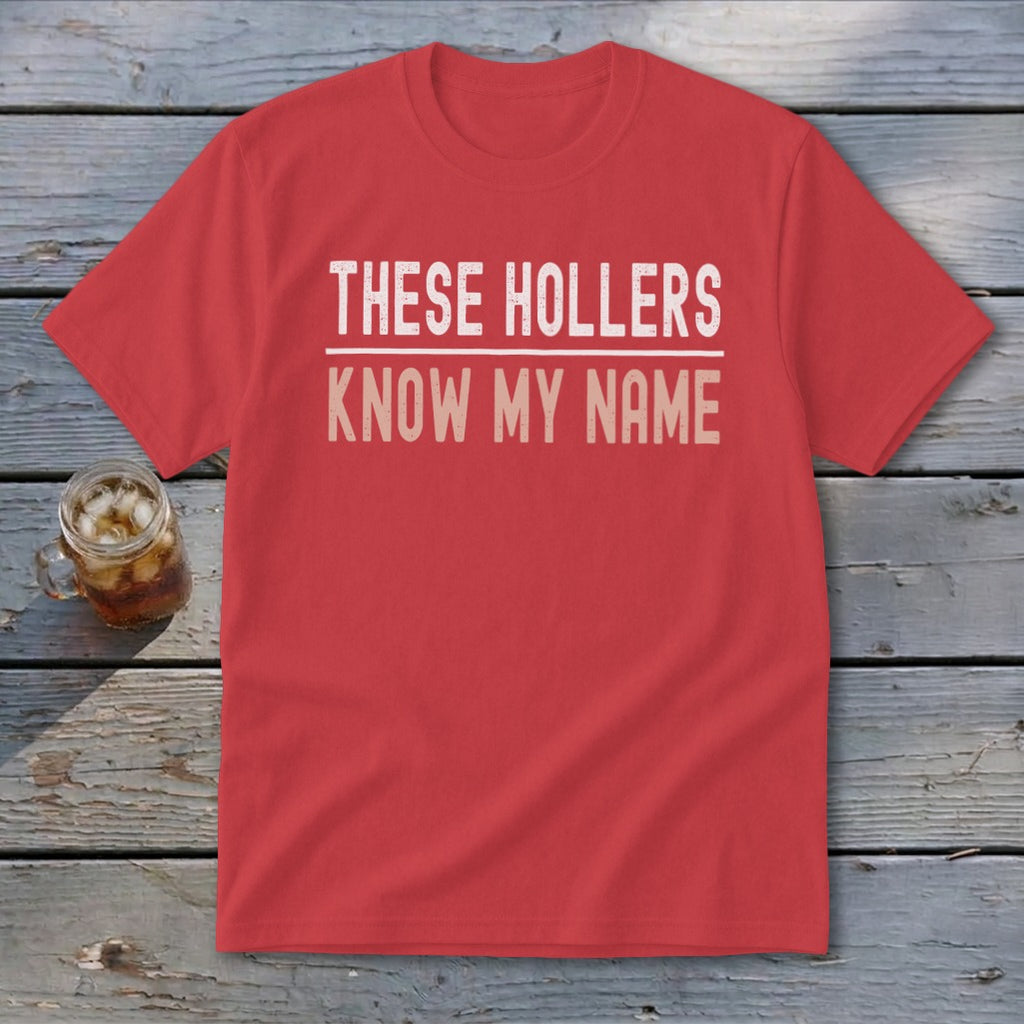 Red t-shirt with "THESE HOLLERS KNOW MY NAME" text in white and tan.