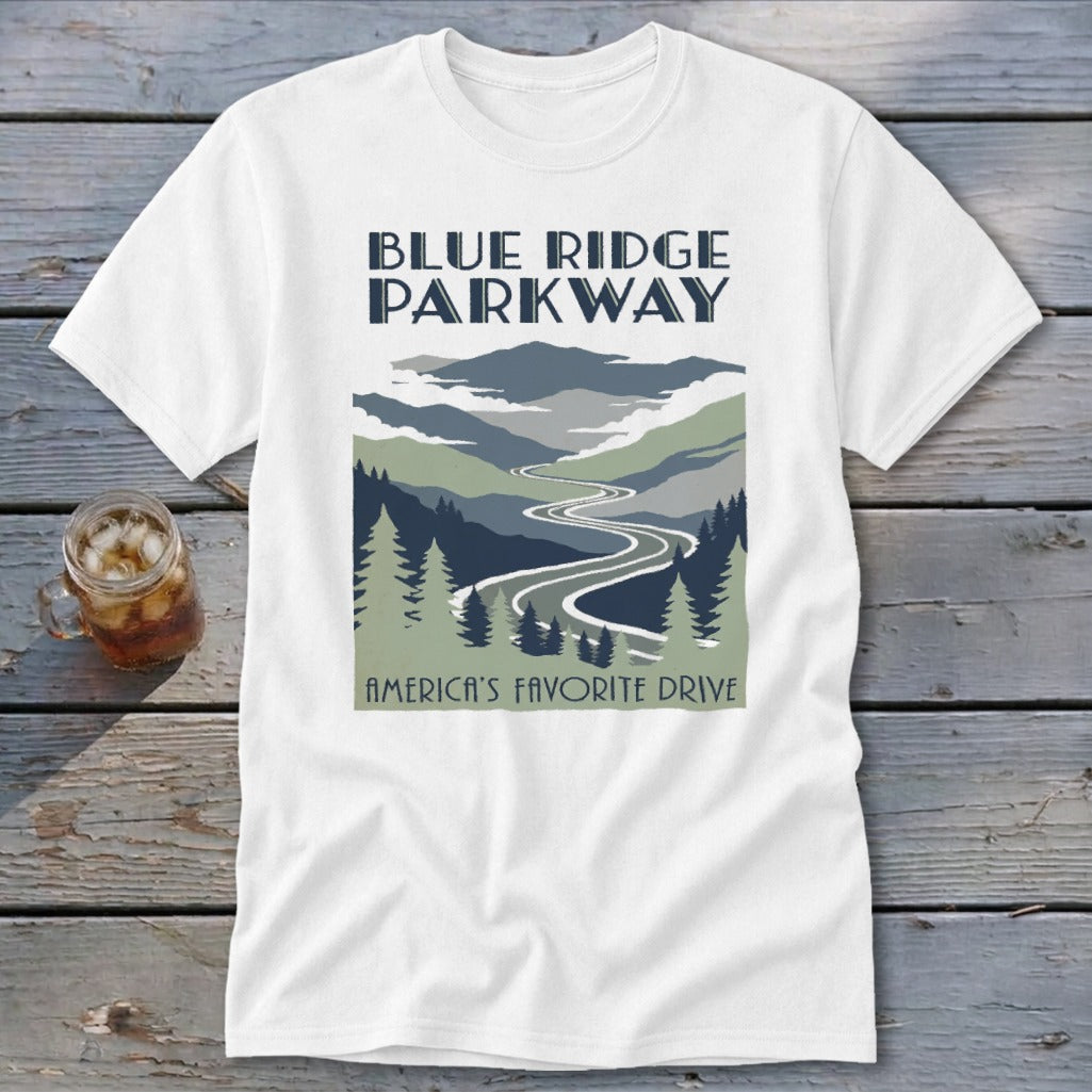 A white t-shirt featuring a Blue Ridge Parkway graphic with mountains, trees, and a winding road.