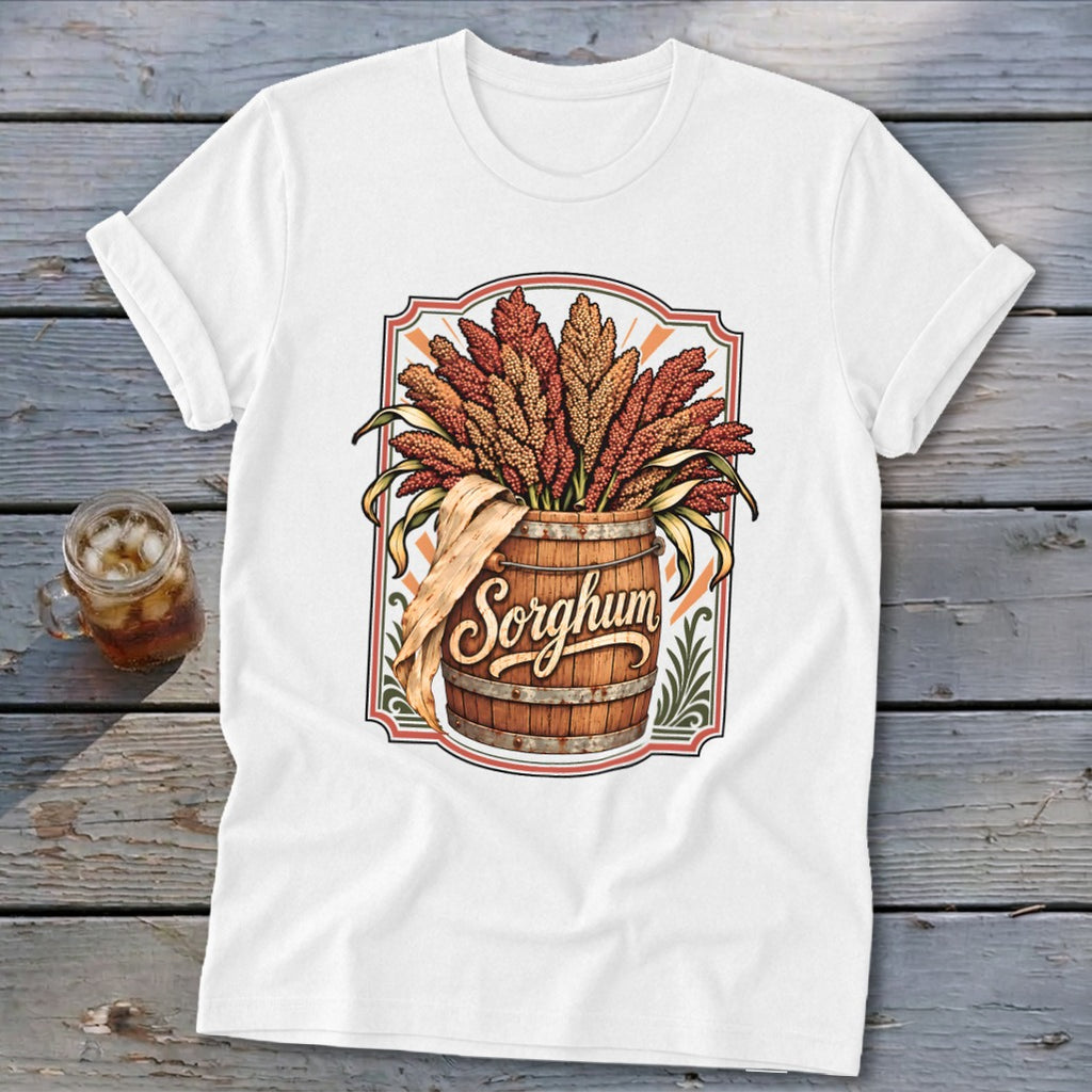 White t-shirt with sorghum stalks in a wooden barrel, featuring the word "Sorghum".