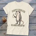 Opossum holding a mug with text "Don't mind me I'm just sulled up."