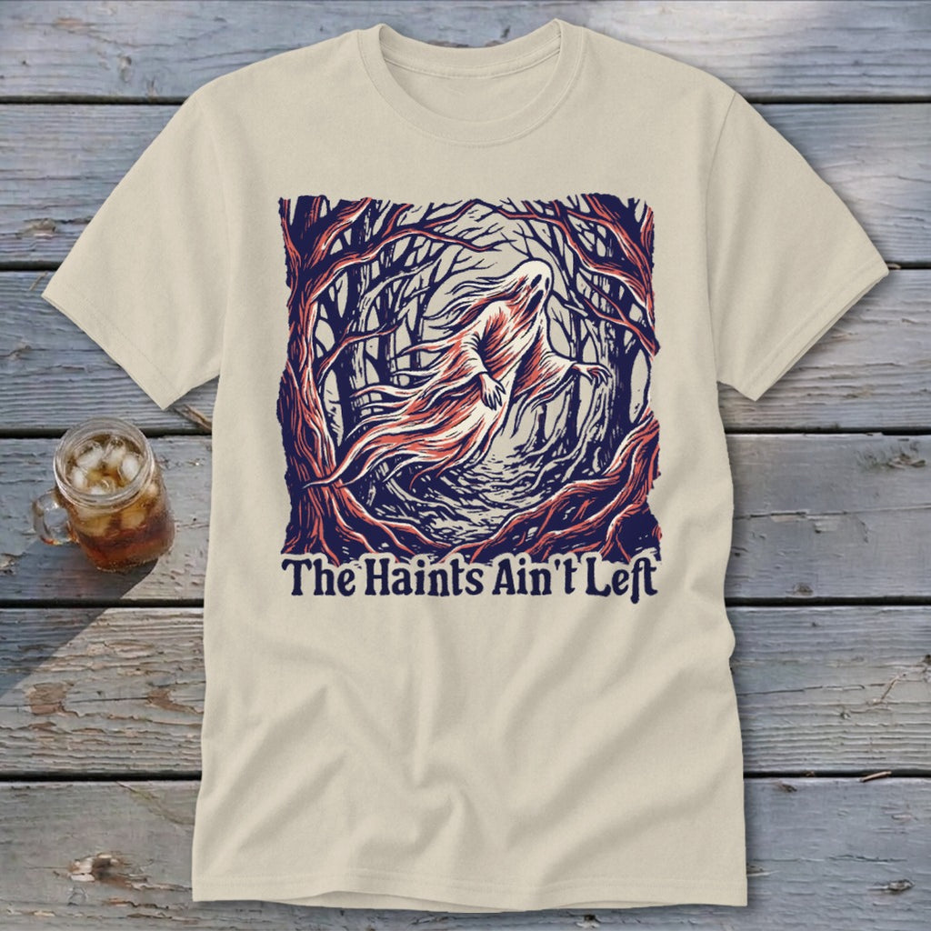 Cream t-shirt with ghost in forest graphic and text "The Haints Ain't Left."
