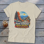 T-shirt graphic: Peak weekend. Same playlist. New overlook. Autumn mountain road.