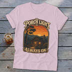 Pink t-shirt with "The Porch Light is Always On" text and cabin scene graphic.