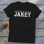 Black t-shirt with white text reading "LOOKING A LITTLE JAKEY"