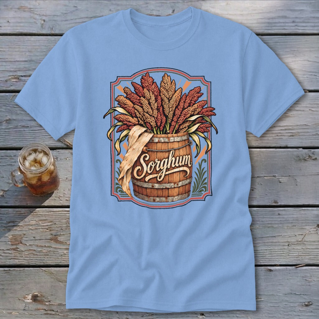 Light blue t-shirt with a wooden barrel overflowing with sorghum stalks.
