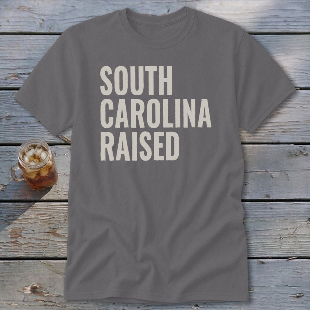 Grey t-shirt with "SOUTH CAROLINA RAISED" text in off-white block letters.