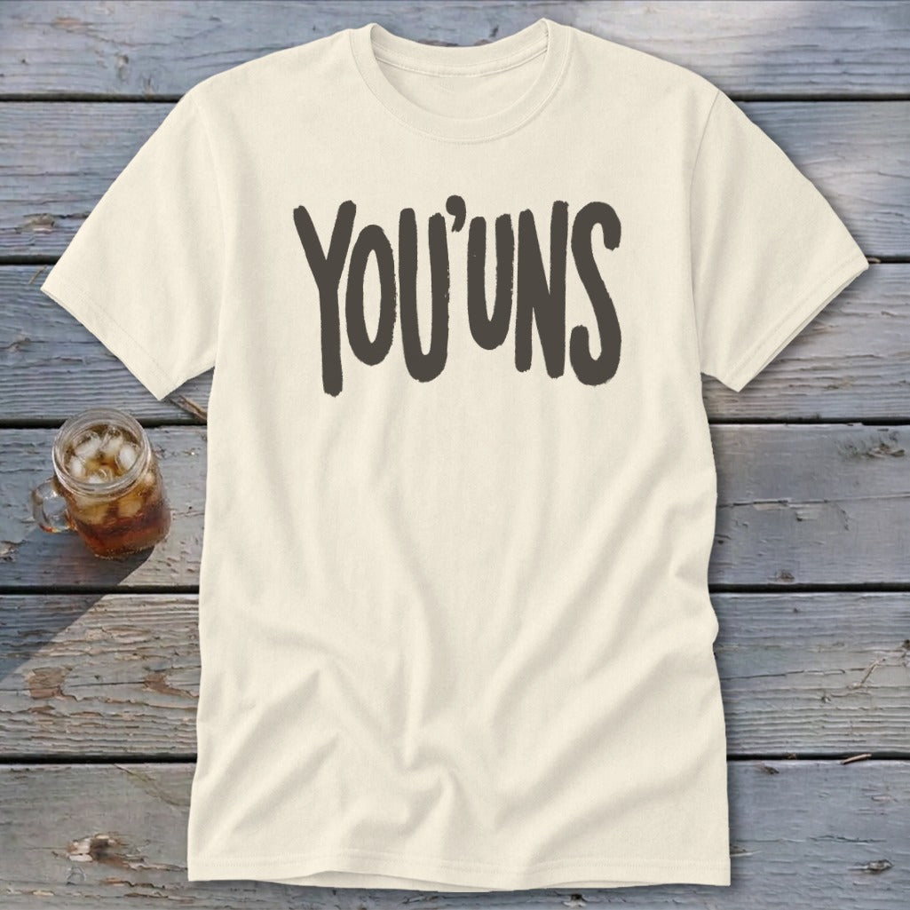 Cream t-shirt with "YOU'UNS" printed in dark gray text.