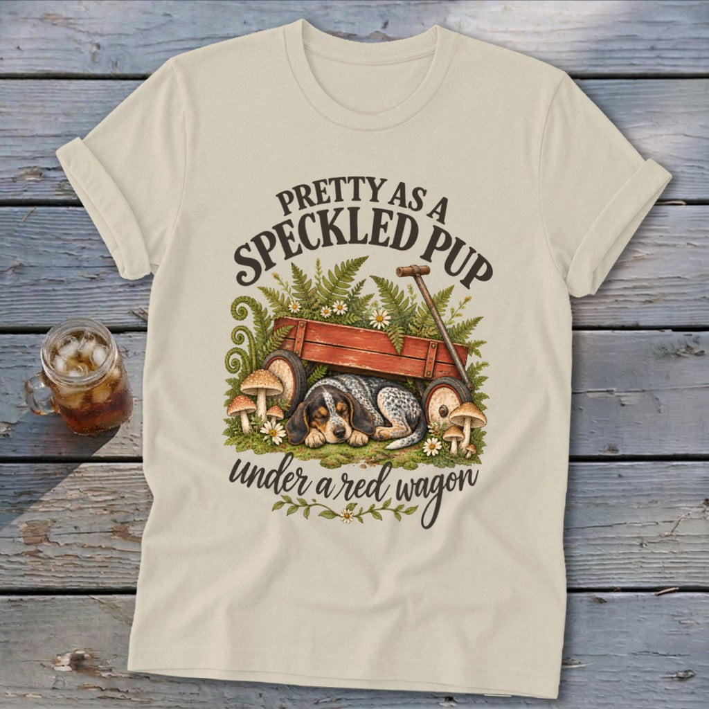 Cream t-shirt with "Pretty as a Speckled Pup under a red wagon" text and dog art.