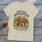 Cream t-shirt with "Pretty as a Speckled Pup under a red wagon" text and dog art.