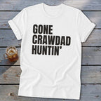 White t-shirt with bold black text that reads "GONE CRAWDAD HUNTIN'".