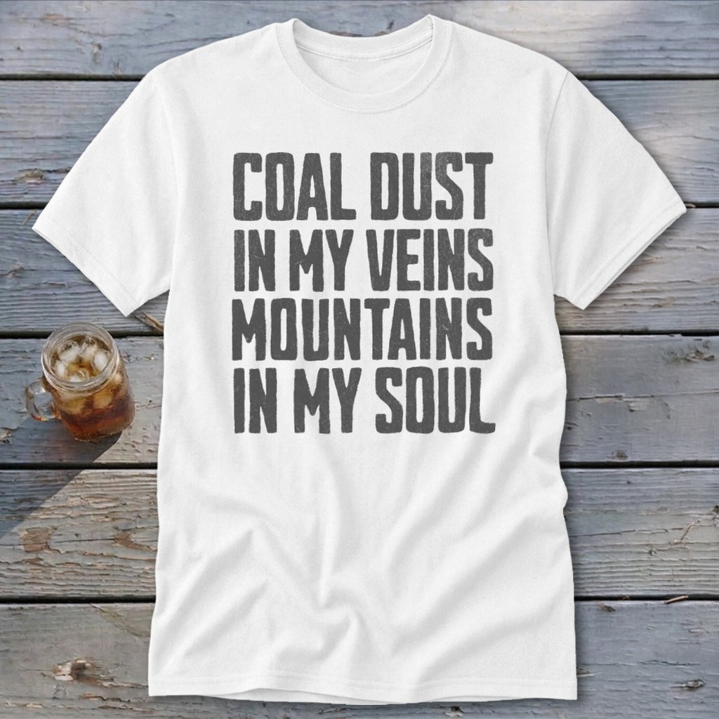 A white t-shirt featuring the distressed gray text Coal Dust In My Veins Mountains In My Soul.