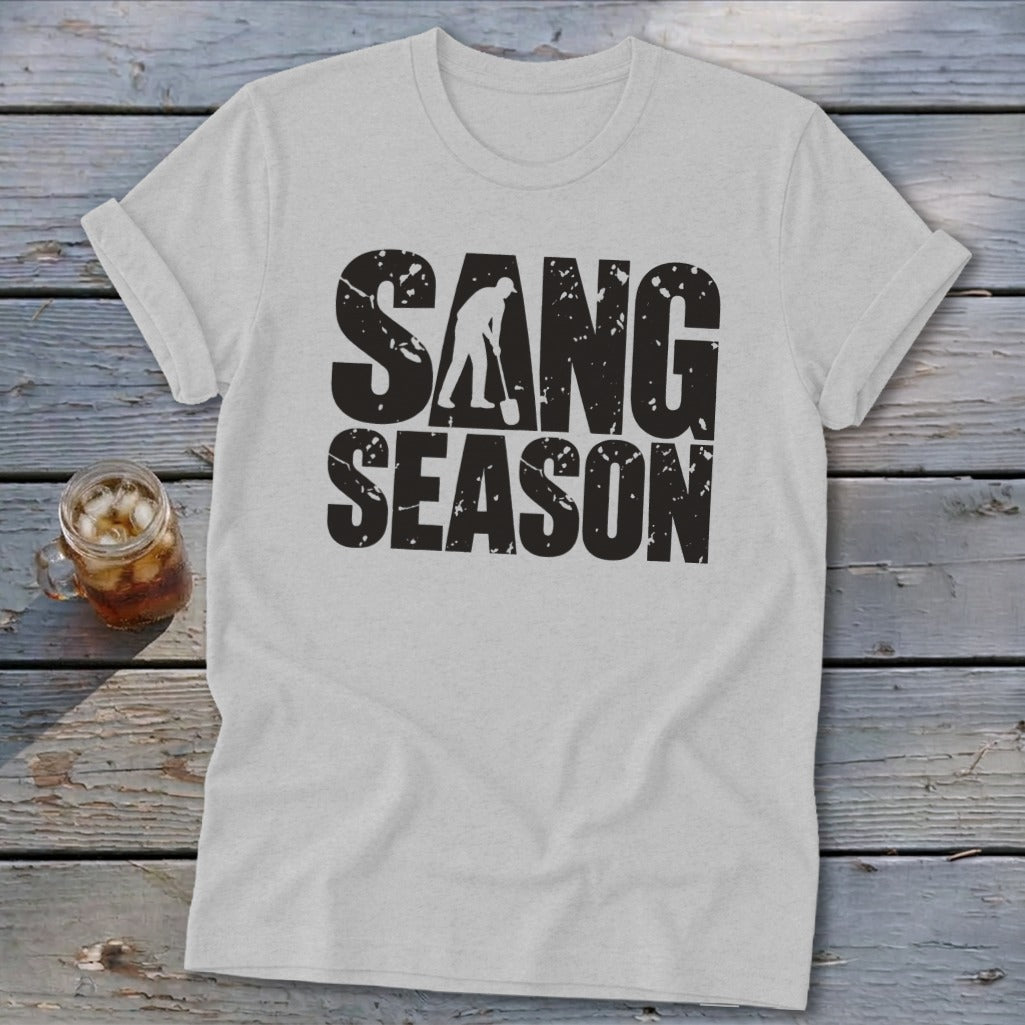 Light gray t-shirt featuring distressed black text that reads SANG SEASON with a silhouette of a person digging.