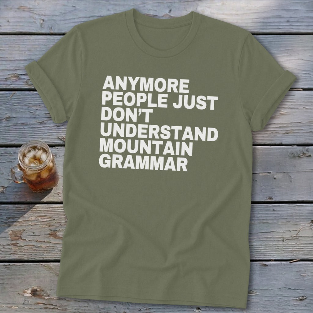 Olive green t-shirt with white text: "Anymore people just don't understand mountain grammar."