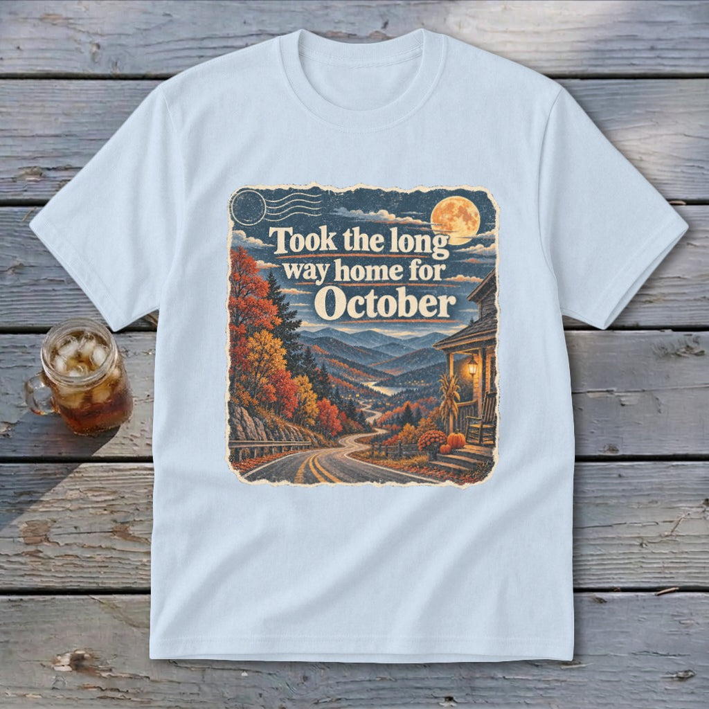 Light blue t-shirt with graphic "Took the long way home for October" and autumn mountain scene.