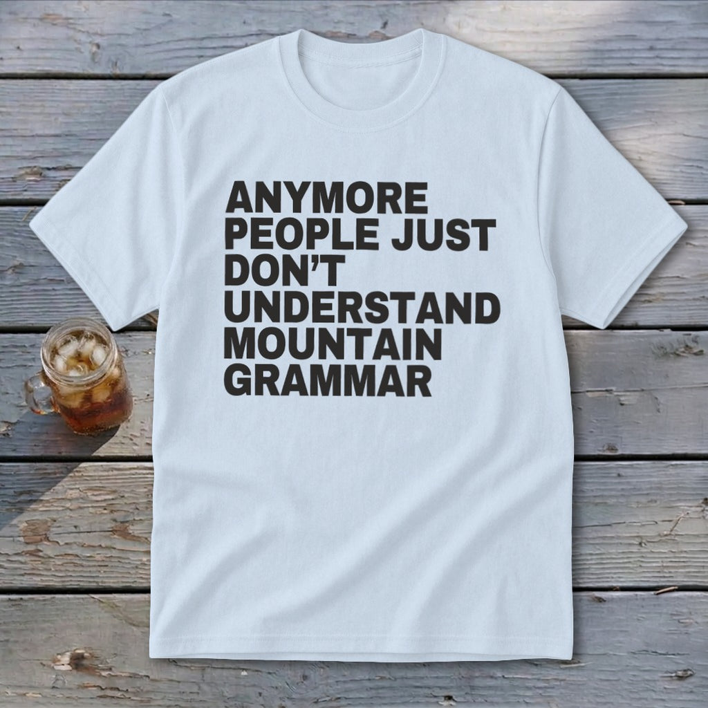 White t-shirt with black text reading "anymore people just don't understand mountain grammar".