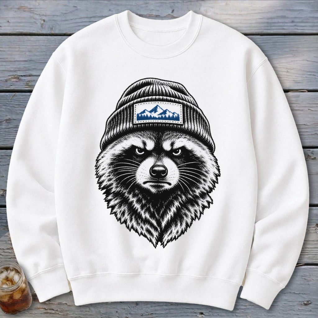 White sweatshirt with a grumpy raccoon wearing a beanie with mountain graphic.